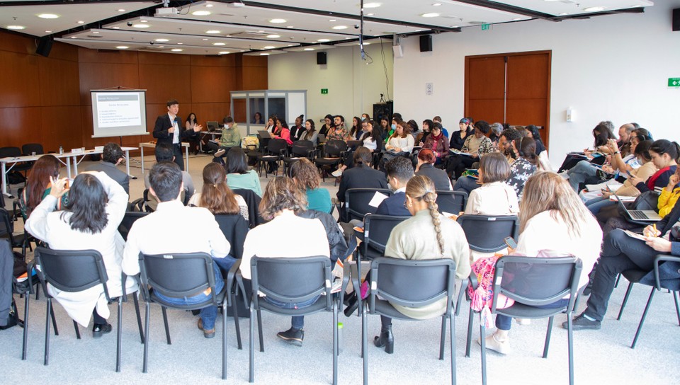 a crowd convenes for the presentation of Prof. Lisa Davis before the International Criminal Court