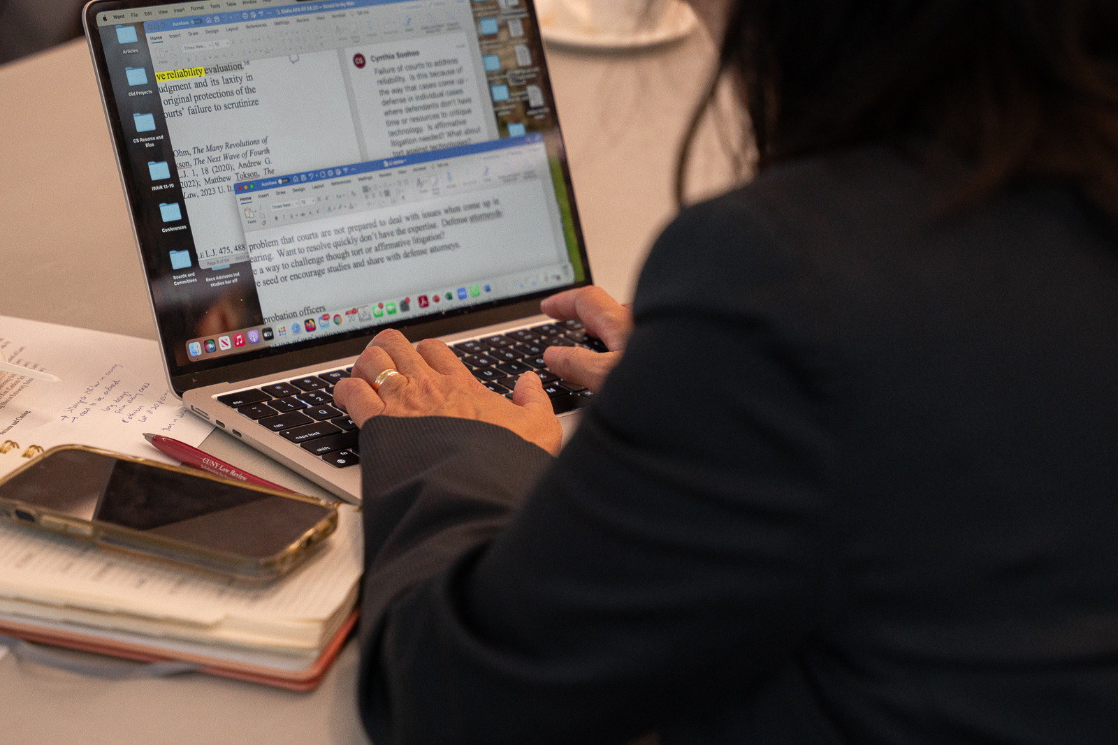 AAPI Guest takes notes on a computer during the conference.