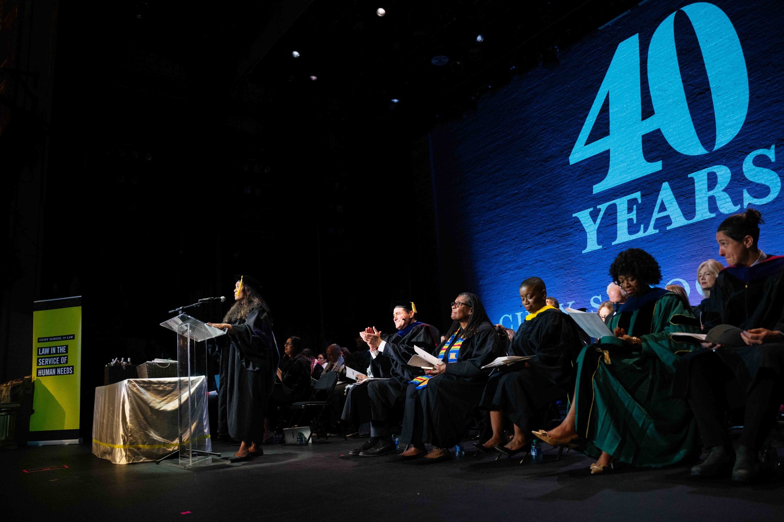 The CUNY Law Administration and Faculty on stage at the Apollo Theater for Commencement