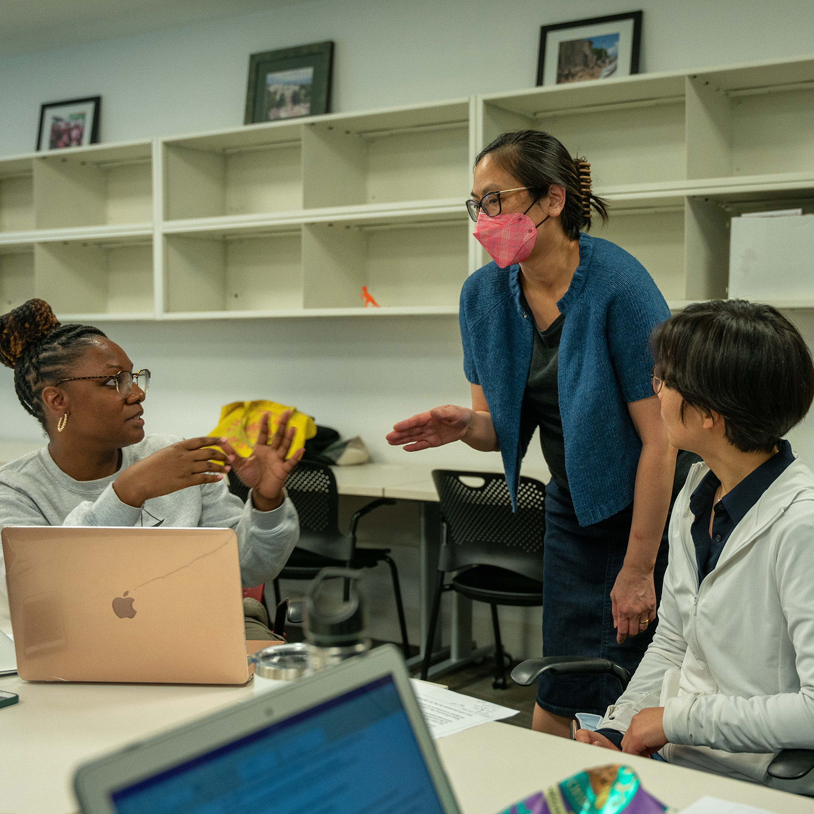 Professor Lu speaking with students