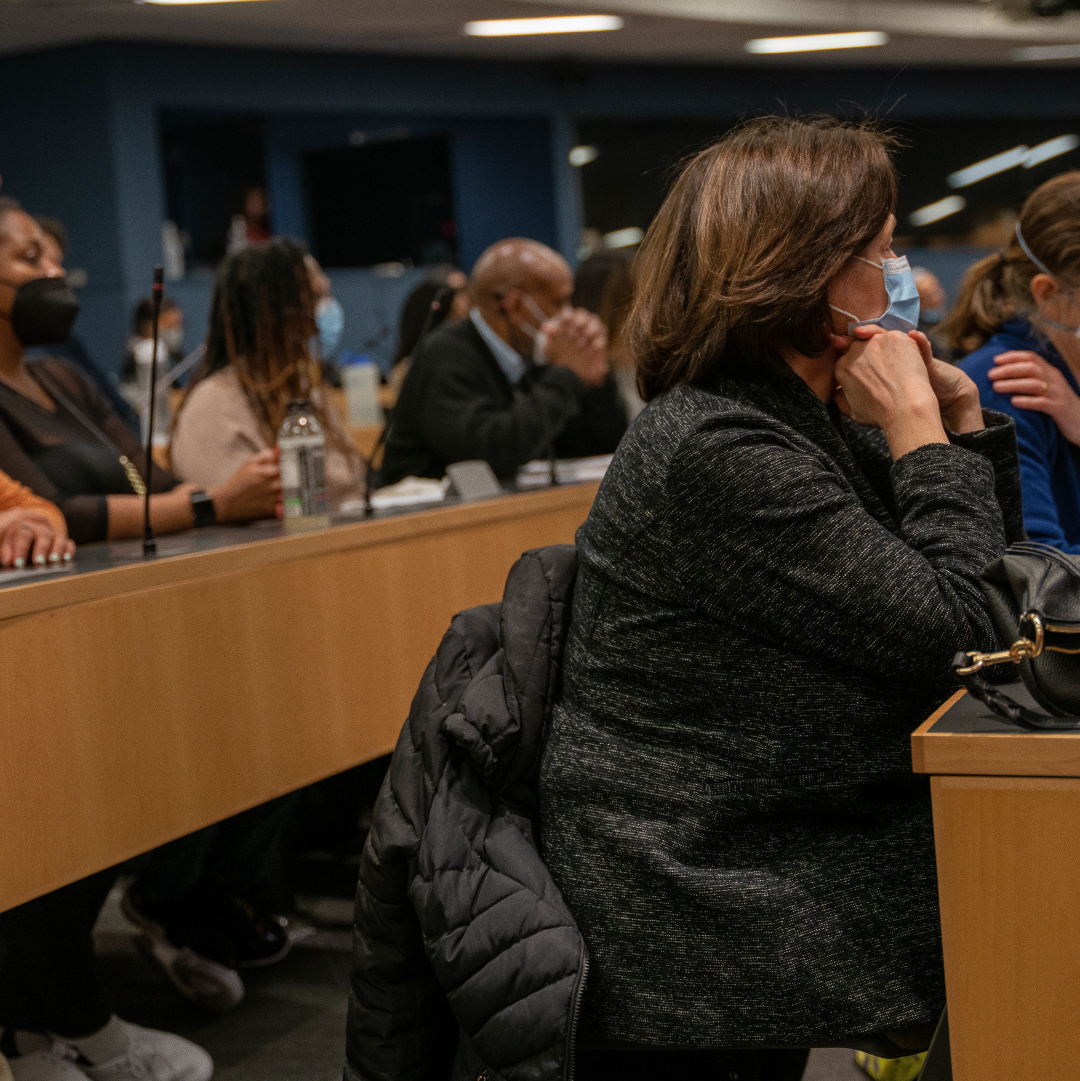 People listen to a presentation in the CUNY Law Dave Fields Auditorium