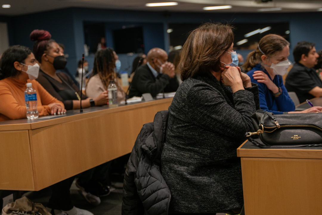 People sit listen to a presentation in the Dave Fields Auditorium at CUNY Law