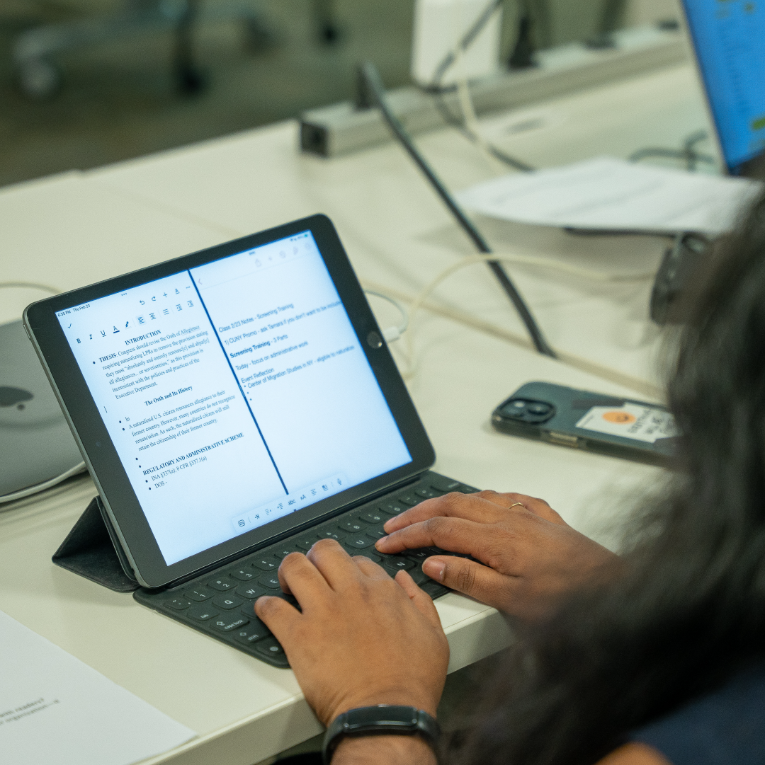 A person types on a tablet