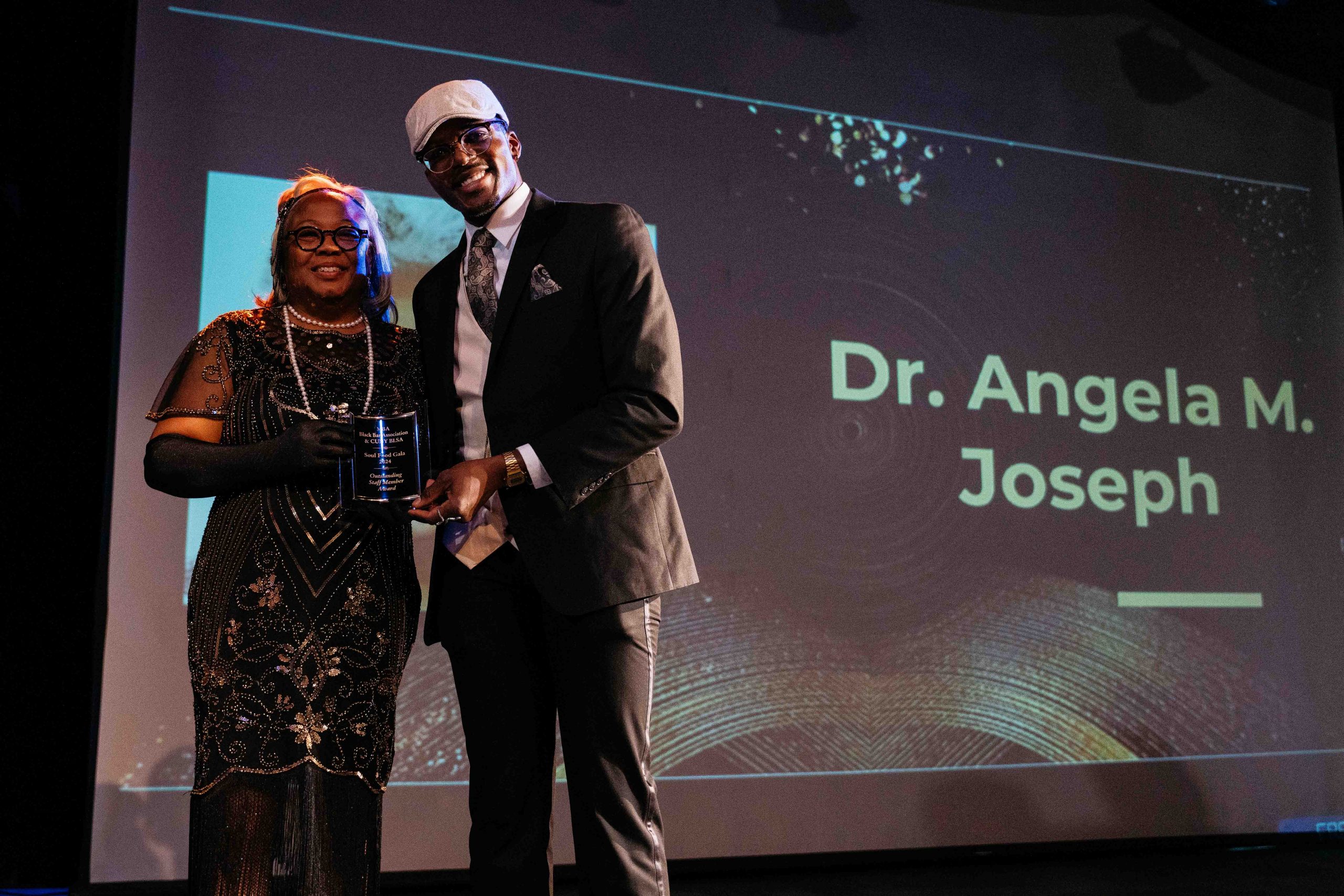 Dr. Angela Joseph receives an award at the CUNY BLSA Soul Food Gala.