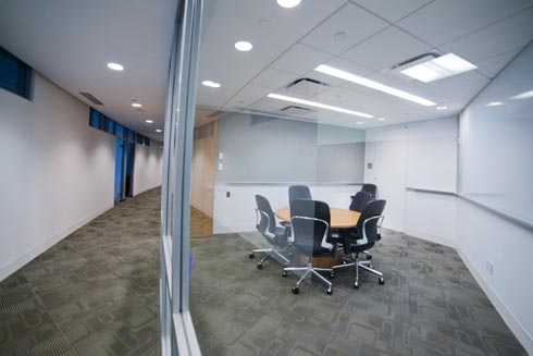 Small conference room with glass wall and small round table