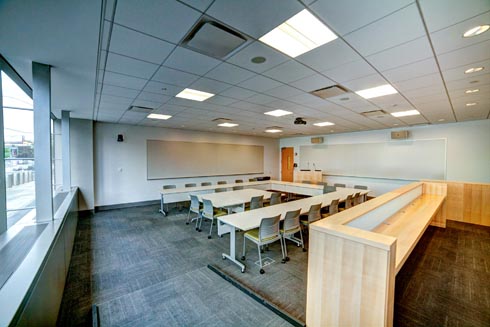 moot courtroom with a judges stand and tables and chairs for participants