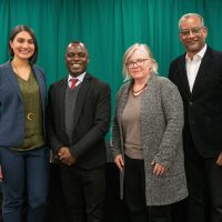 Vince Warren, Frank Mugisha, Jeena Shah and Pamela Spees pose for a photo.