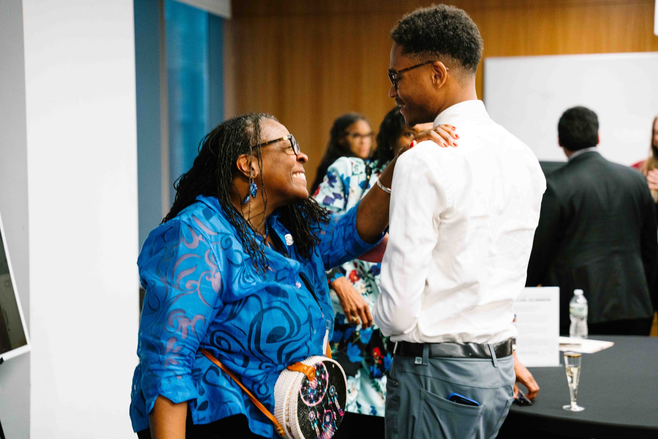Image of attendees at the First Impressions 2nd Annual Celebration Ceremony, celebrating achievements and honoring individuals for their contributions. The event features speeches, awards, and networking opportunities in a formal setting.