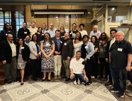 Group photo of all 20+ attendees Busboys and Poets at the Alumni Happy Hour in DC.