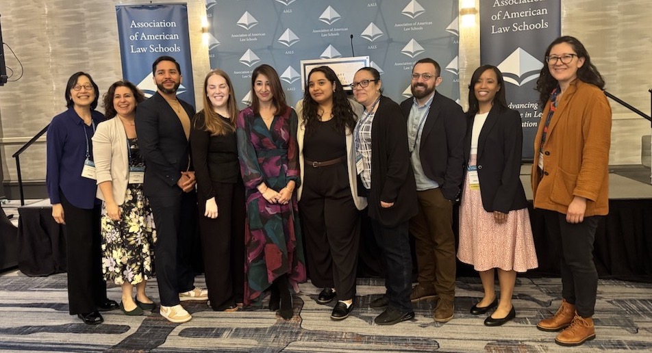 faculty pose for the CLEA award