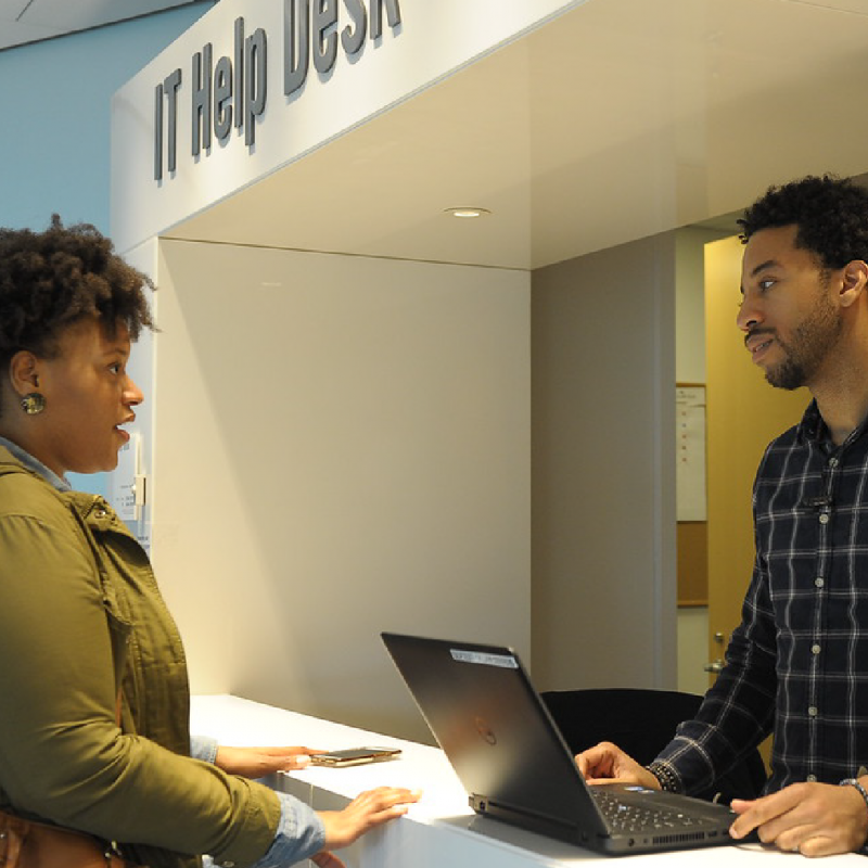 A student getting assistance at the CUNY Law IT Help Desk
