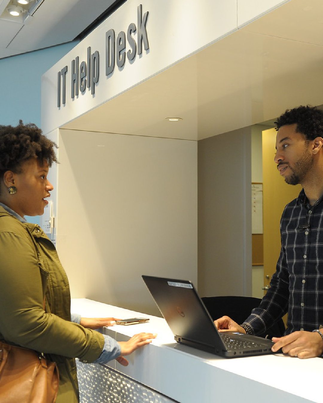 A student getting assistance at the CUNY Law IT Help Desk